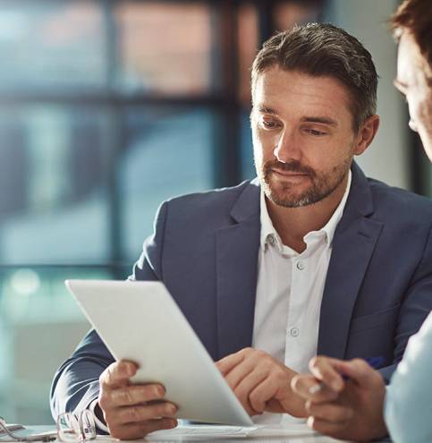 Two men are discussing business